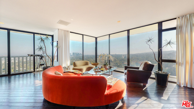 9255 Doheny Road 1602 West Hollywood, California Rare opportunity to live in the most Coveted building! This corner unit has unparalleled amenities and explosive panoramic views. Filled with lots of light this unit offers very spacious living areas; living room, den, home/office, and separate kitchen. Master bedroom has large bonus room (that can be used as a walk-in closet). Hardwood floors throughout, washer-dryer inside with private laundry room. Newly renovated building amenities include 24/7 concierge and security, valet parking, community gym, and pool.