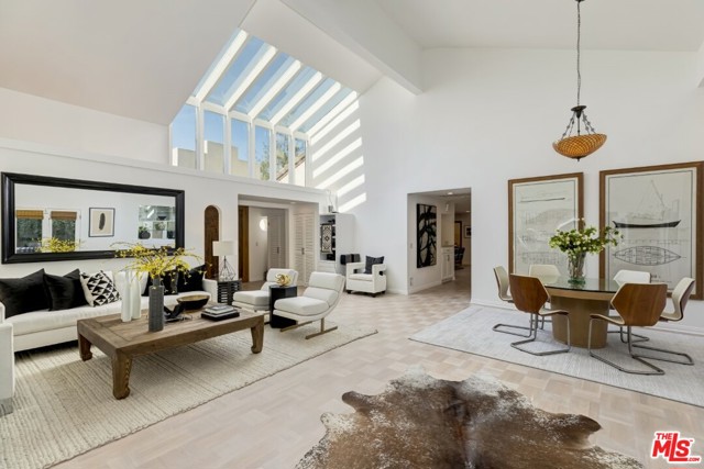 956 Kagawa Street Pacific Palisades, California Calm, luxury & desirability characterize this large corner-lot, one-story home in one of the world's most sought-after locations. The joys of indoor/outdoor living await as you enter the large living/dining rm w/soaring vaulted ceilings & oversize skylight, perfect for indoor entertaining. The bright great rm greets you with a spacious & updated kitchen including granite countertops, wet bar, and high-end ss appliances. French doors let in the ocean breeze over the lush, fragrant roses and plants and the sparkling pool/spa w/the best in salt water heated systems. Five bedrooms - one of which can be an office - and 4.5 baths makes this an ideal home for your family and/or guests, to enjoy the surrounding amenities such as Palisades Village, hiking trails, the beach, and the best in dining & entertainment only minutes away. Two patios amid lush greenery, three wood-burning fireplaces, a detached 2-car garage w/attic for storage, many recent updates, thick Danish oak floors, all meticulously maintained, make this home the ideal in fine California Coastal living. Buyers Please Note: Public record shows 4 bdrms, 2 baths; please verify permits; chimneys have not been recently inspected so please be aware no chimney credits or repairs. Pre-inspection reports and disclosures are available before writing your offer. Offers due by Thurs, May 6th, but no earlier.