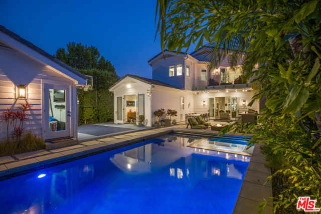 1045 Harvard Street Santa Monica, California Extensively upgraded traditional home with a contemporary flair, constructed brand new in 2014. There have been over $750,000 of upgrades since the house was built Set in the highly acclaimed and desirable Franklin School District of North Santa Monica, the property is set on a beautiful tree-lined street and gated from the sidewalk with beautiful mature professional designer landscaping. An ideal floor plan that consists of five bedroom suites (four bedrooms up & one bedroom down). The interior is almost 4,600 SqFt and set on a large approximate 8,000 Sq.Ft. flat lot. The main level includes a formal entry, formal living, formal dining, library/office, powder room & large-scale family room plus kitchen combo that opens to an expansive magical and secluded backyard with professional mature landscaping, lighting, pool, spa, waterfall, sports court, outdoor kitchen, and detached garage. The open kitchen with top-of-the-line Viking stainless steel appliances and huge center island sits near a wine collectors state of the art highly customized temperate controlled professional wine room with seemingly endless wine bottle storage capacity. The laundry room and main level bedroom suite (which currently serves as a gym), both rooms have separate entrances. There's a second family room upstairs along with a bonus room adjacent to the master bedroom that could be used as a nursery or additional office. The master suite romantically gazes out over the lushly landscaped backyard through french doors, expansive deck, and fire pit. The house is conveniently set near Erewhon, boutique Montana Ave. shopping/restaurants, the Brentwood Country Mart, top-rated schools, beach, hiking, bike paths & all that Westside beach living has to offer.