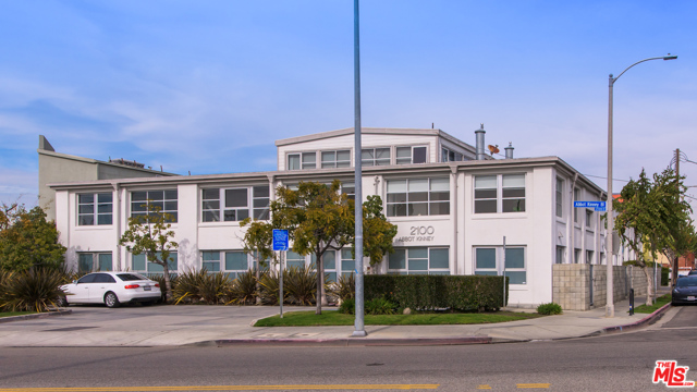 2100 Abbot Kinney Boulevard A Venice, California Beyond extraordinary live/work opportunity located in the landmark Bay Cities Laundry on Abbot Kinney Boulevard. The original 1923 building, designed by renowned architect Mark Mack, underwent a complete restoration and re-adaption into seven incredible lofts in 2004 with superb architecture, layout, and an enviable location. Unit #A is the prime unit as it comprises the whole side of the complex fronting Abbot Kinney, allowing for superior natural light and terrific exposure.The lower level features bright & open living in a studio-style layout accented by 2-story heights and three walls of glass plus a gallery entry, an office/bedroom, full bath, laundry, fully appointed kitchen, and a private patio, great for alfresco dining. Above are a loft and main bedroom, each with high trussed ceilings and adjoining baths. Other highlights include central heat and air, wired for alarm, and polished concrete and bamboo floors. There is a private two-car garage.This property is zoned for both commercial and residential use, optimum for a primary residence, production company, tech start-up, artist, design professional, +++. And in a premier location, surrounded by trendy shopping and dining, six blocks to Venice beach.
