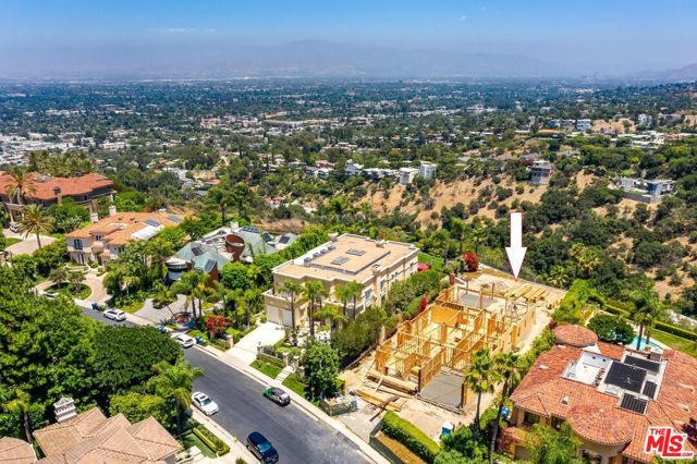 13980 Aubrey Beverly Hills, California This brand new elegant custom French Provincial Manor (under construction and will be completed soon) offers unparalleled craftsmanship and exceptional amenities! Located in the world-renowned enclave of Mulholland Estates. Situated on an expansive 24K+ sq ft lot with panoramic city and mountain views! The richly appointed spaces includes 5-bedroom suites, an office, family room, formal dining room, wine cellar, main professional graded kitchen plus a catering kitchen, art gallery room, several terraces, pool, spa and so much more.