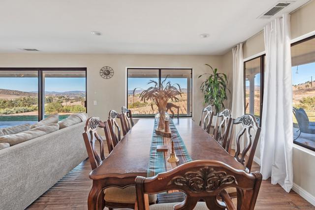 Dining area next to living room with view