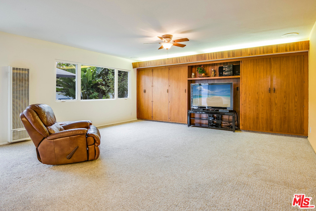 Wi grand cabinetry and natural light shining rough