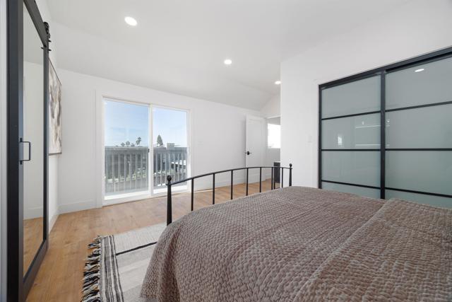 Primary bedroom with deck overlooking the ocean