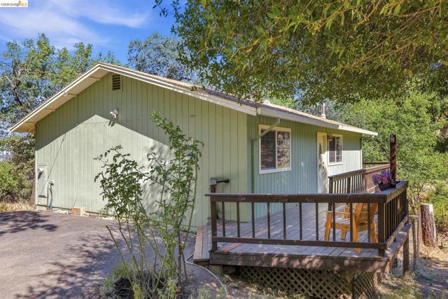 Light green board-and-batten siding with white trim