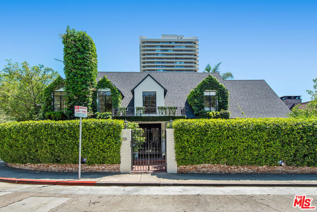 Nestled in a quiet area, adjacent to Beverly Hills, is a wonderful, 4 bed, 5 bath home waiting for you!  Charm abounds and no expense has been spared. Hardwood floors, recessed lights & crown moldings throughout.  This gated property is very private.  Main level features a spacious living rm, family area with wet bar, cozy den, formal dining rm, spacious breakfast rm & huge, remodeled kitchen.   Formal entry with a spiral staircase to the 4 upstairs bedrooms.  Grand primary suite with huge walk-in-closet, balcony & large light and bright bath.  Laundry is located up.  There is a back staircase that will take you down to the den on the first floor. From the den you can access the garage as well as the few steps down to the sound studio on the lower level.  This great space, which has been used as a music studio, makes a great office or guest rm, with a separate entrance.  The yard feels like Shangri-la with mature trees, pool, spa & spacious sun terrace. Close to trendy restaurants.