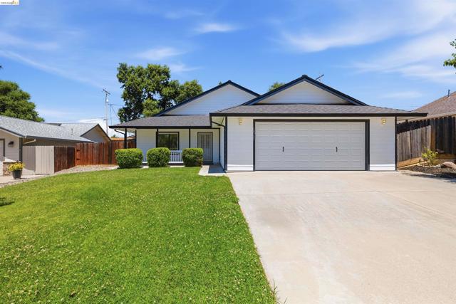 Contemporary ranch-style home featuring a white exterior with dark trim