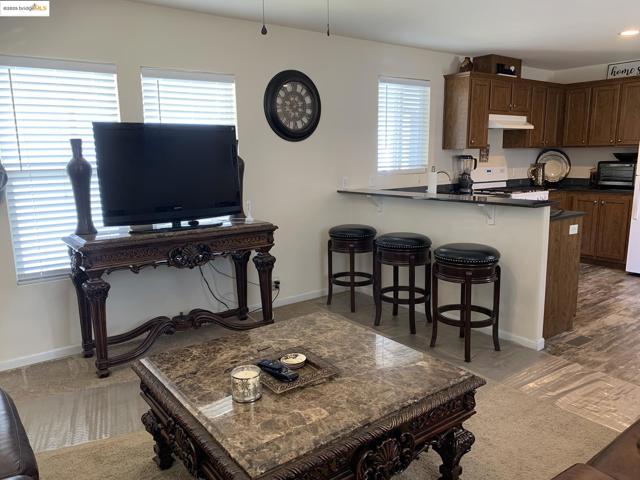 Living area featuring baseboards