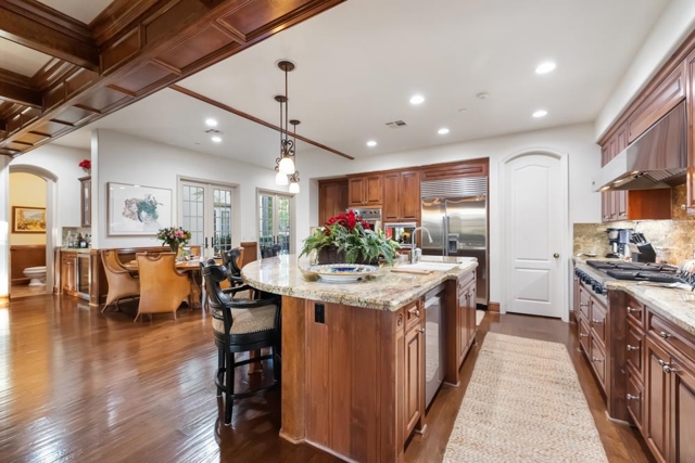 Beautiful kitchen featuring large island, double ovens, walk-in pantry.