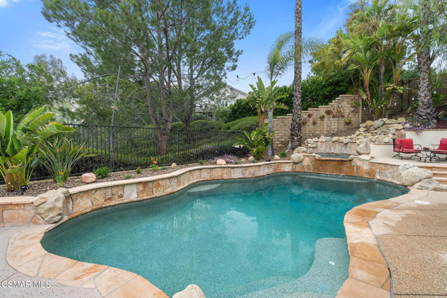 Pool with waterfall and spa