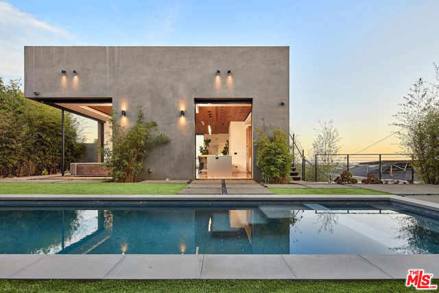 837 BERKELEY Street Santa Monica, California Introducing 837 Berkeley, undeniably the most breathtaking and exquisite home residing within one of the most coveted areas in Santa Monica. Architecturally designed by William Adams, this custom residence showcases bold design while encompassing warmth through its alluring architecture, exquisite custom interior features, striking quality, and unobstructed views from almost every room. // What to know about the home: The spacious 5 BR + 8 BA home boasts a home theatre, entertainment area, wine cellar with a 300 bottle capacity, ground level 6+ car parking abilities, office, pool retreat, private decks, and a rooftop terrace with 360-degree views. The extensive Chef's kitchen is the perfect place to get together with friends and family in addition to the dining room, and multiple outdoor entertainment areas. Every bedroom is sizable with an ensuite bathroom and walk-in closet, creating privacy. Your primary bedroom encompasses elevated elegance with ocean views, a private balcony, an expansive walk-in closet, his and her bathroom areas, a walk-in shower, and a jacuzzi tub. Whether you are a movie buff, wine enthusiast, or car collector - this home is has got something for you! // What you'll love: Throughout the home, there are striking finishes and details surrounding every inch. The gleaming Ipe hardwood floors and ceiling throughout create an unmatched warmth complimented by textured Hawaiian lava stone slabs for a unique design. Every level of the home creates a private retreat, accompanied by an in-house elevator for convenience and ease. Other fine details include Arcadia pocket doors, skylights, an original wood-burning fireplace with gas starter, MGS stainless steel faucet, Toto toilets, Italian-made cabinets and light fixtures, natural stone used throughout the entire home, and a smart home app with control capabilities for blinds, sound system, and lighting. // Your favorite spot will be: As you find yourself on the main level, the Chefs kitchen offers cutting-edge workmanship through the detail and functionality of the stainless steel countertops, Ipe wood floors, top-of-the-line appliances including a Miele dishwasher, and Gaggenau cooktop, sleek built-ins, and wood counter breakfast bar. The glass pocket doors lead to the back garden and pool area creating an unbeatable indoor/outdoor atmosphere where you can soak in the incredible Santa Monica climate. What We Love Most: // The views! The views this property has to offer are unmatched. From sunrise to sunset, enjoy breathtaking views from any of the front-facing decks, as you lounge by the fire pit or head up to the roof terrace for panoramic views of the city and ocean vistas make this house an entertainer's dream. // Notable about the neighborhood: Conveniently close to the best restaurants, shopping, and coffee shops along Montana. Join us in discovering why The Berkeley Hill is such a special part of Santa Monica with its ocean views, and an award-winning school district.