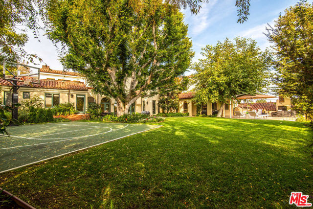 15900 Alcima Avenue Pacific Palisades, California This custom-built Spanish estate has 5 bedrooms, 5 bathrooms and is located moments away from Palisades Village. There is a fabulous updated cook's kitchen and bright living room with high ceilings and French doors that open up to a beautiful patio, perfect for entertaining. The primary suite has its own private balcony with views of the ocean and a sumptuous spa-like bathroom retreat. Other unique features include a dramatic two-story wing that can be used for screening, workouts, or entertaining. The large private park-like backyard comes with a 63-foot swimmers pool, spa, and a basketball sports court. This stunning home also offers a rare attached four-car garage. Don't miss out on this rare opportunity. Location, location, location.