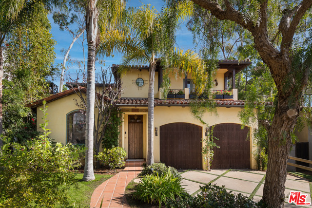 906 Iliff Street Pacific Palisades, California This home is not to be missed. Located in the heart of Pacific Palisades. Custom designed to perfection with immaculate interiors and an exterior that will make you feel like you are on vacation. Recently upgraded modern Spanish style family home is an entertainers dream. Custom features include tile floors, beamed ceilings, leaded stained glass window, cast stone fireplace, forged iron work, and sophisticated light fixtures. The gourmet kitchen with breakfast nook and adjoining family room, open out to the rear patio and pool. Upstairs, the Master suite has its own sitting room and spacious bath. This home is outdoor living at its finest. The extraordinary entertaining space starts with the pool and waterfall, which wraps around the outdoor casita, which is complete with a fireplace, TV and outdoor dining/lounge area. There is an outdoor kitchen with Wolf BBQ and authentic Italian pizza oven, seating area, and fire pit. Close to the Caruso Village, beaches, hiking trails and more.