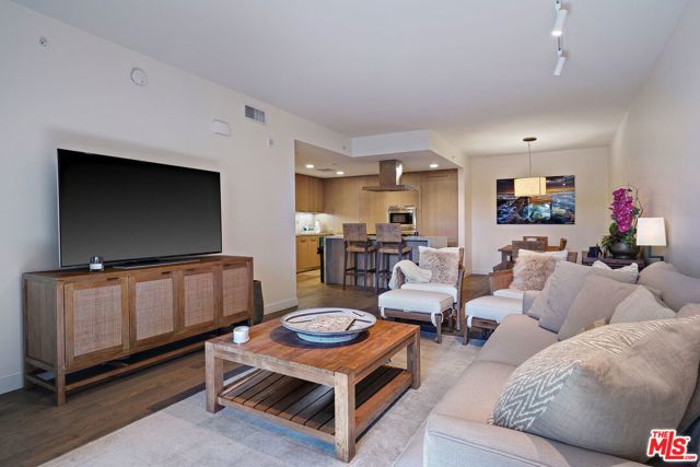 1755 Ocean Ave 308 Santa Monica, California This pristine condo is the largest one bed unit in The Seychelle & the ultimate Santa Monica dream. In a premier location, live seconds from the beach, trendy shops, restaurants, & recreational activities on Main St. and Abbot Kinney. This bright & modern unit greets you w/a beautiful open floor plan that flows seamlessly from the kitchen to living and dining area. Glossy light hardwood floors, marble finishes, and high end finishes throughout the home give it its sophisticated and elegant ambiance. Living area w/large glass sliding doors create a tranquil indoor/outdoor feel. Spacious kitchen w/ss appliances & sleek marble island. Unwind in the master w/view of the lush landscaping, modern master bath featuring marble countertops w/dual sinks, glass shower, spa tub & ample closet space. Unit also has a guest powder room. Amenities include in-unit laundry, rooftop pool w/lounge, fully equipped gym & concierge. This modern all inclusive Santa Monica condo is a dream to call home!