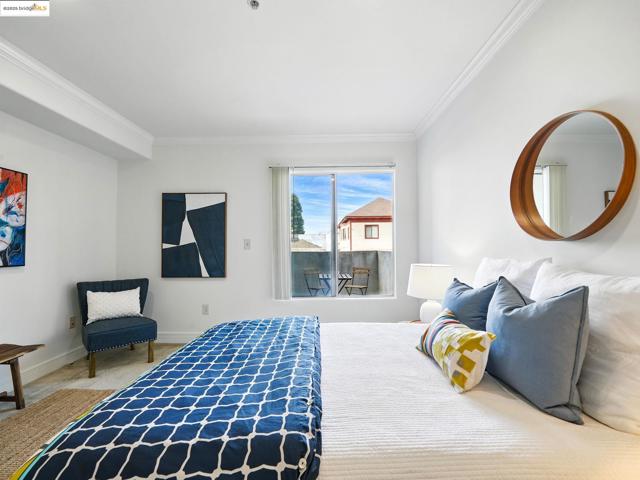 Carpeted bedroom with crown molding
