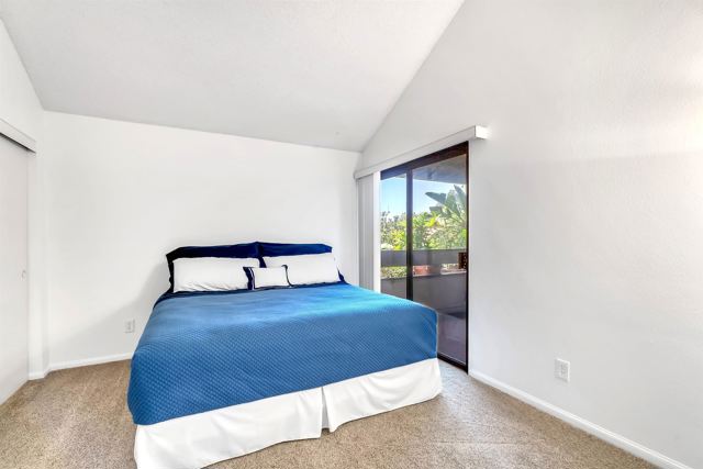 Large Guest Bedroom with Tall Ceiling and Direct Access to Balcony