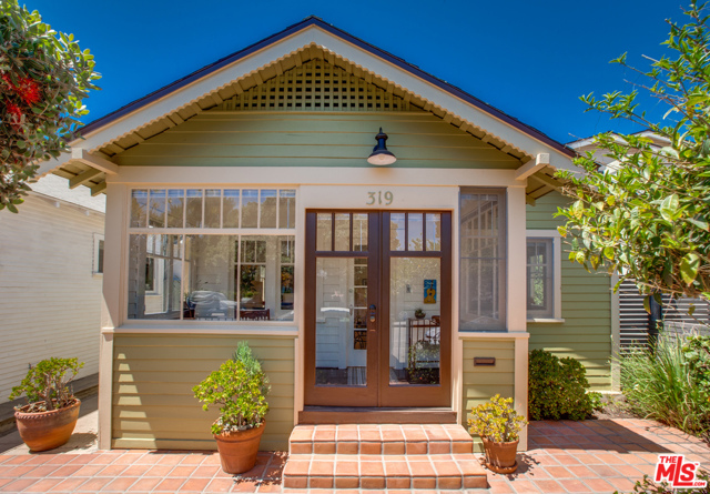 319 Windward Avenue Venice, California Situated in one of the best locations in Venice Beach, the pretty and historic, third block Windward Ave, this home is the quintessential beach bungalow. With close proximity to both Abbot Kinney Blvd and the Beach, the location is amazing. This 2 bed / 1 bath home benefits from being recently remodeled, including brand new kitchen and bathroom, as well as refinished hardwood floors, painted throughout and new roof. This charming beach pad is filled with light and air and the kitchen and master bedroom benefit from high pitched ceilings, with skylights, both with french doors, that lead onto the tranquil and superb Yard area. This charming courtyard area is both private and spacious, perfect for entertaining and relaxing. The property further benefits from excellent parking and storage spaces, which include, private garage, car port and storage room. This truly special beach bungalow has a happy, magical feel and is steps from all the best the beach has to offer.