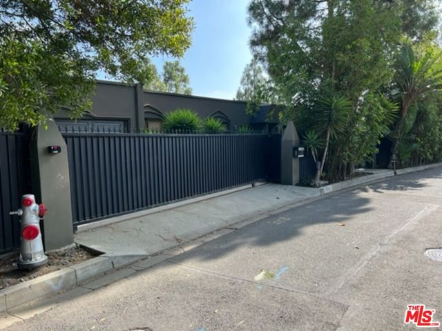 1263 Lago Vista Place Beverly Hills, California Private enclave, located on one of Beverly Hills most desirable streets. This beautiful Mid-Century inspired residence sits on over an acre, in central Beverly Hills. Nestled at the end of a quiet cul-de-sac North of Sunset, in the City of Beverly Hills, surrounded by multi-million-dollar estates. Enter through the private courtyard to this 3-story home that features a large living room, gourmet kitchen, family room, large owner's suite and 4 other bedrooms. Breathtaking city views spanning across the LA Basin showcase the reason this is the city of dreams. With a pool, terrace and views, this property offers the comforts of a retreat while just a short drive from the world class restaurants and entertainment of the city. (Permit application is pending review for remodel and sq. footage increase from 2,900 to 4,500 sq. ft.) The basement area (per old definition) was not originally included in the floor area calculation. Remodel (not over 50%) of single-family residence to include original basement in floor area calculation.