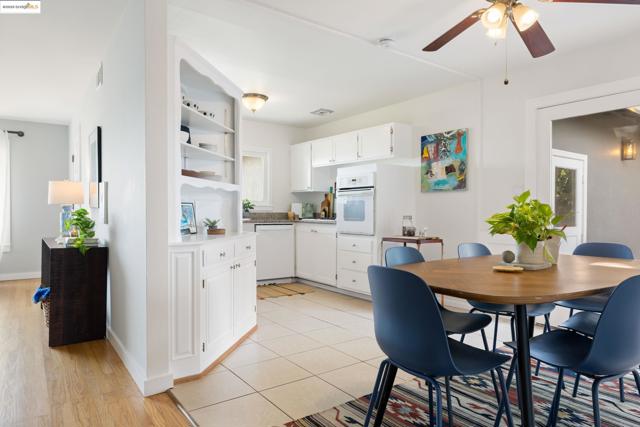 Dining room featuring light tile patterned flooring and ceiling fan