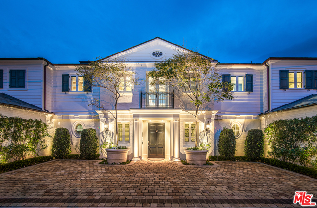 21528 Pacific Coast Highway Malibu, California This captivating estate presents 7,264 SF of Malibu beachfront living at its finest with direct beach access. Enter the 5-bed/8-bath estate through a columned doorway, surrounded by a handset stone driveway and pristine landscaping. A black and white marble tiled foyer leads into the striking courtyard with a deck, pool, spa, and bar. The living area includes a large painted brick fireplace and leads to an expansive deck, overlooking the ocean. A bright sunroom is attached, enclosed in wall-to-wall windows. The kitchen has a large black island, white cabinetry, marble countertops, and stainless steel Viking appliances. The primary bedroom has a private balcony and a bathroom with a clawfoot tub and oversized shower. A theater has walls of French doors, 2 balconies, and a fireplace. With dual 2-car garages, beachside living is made easy. Moments away from the world-class shops and restaurants of Malibu, this oceanfront haven is glamorous yet cozy, grand yet charming.