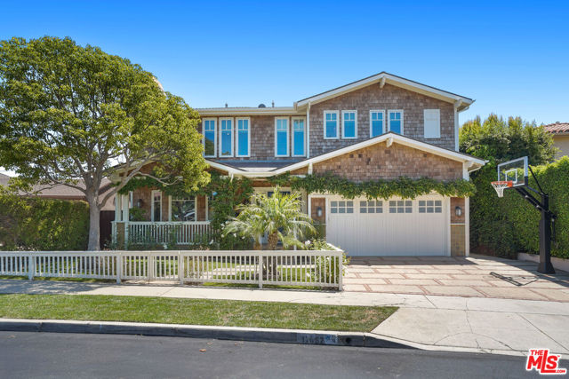 This quintessential traditional Pacific Palisades family home is located on a quiet and quaint tree-lined street in the desirable Marquez Knoll "Bollinger Loop" neighborhood. It is a  very short walk to the acclaimed Marquez elementary school and an easy distance to the beach, shops and restaurants at the Palisades Village, and hiking trails. A gorgeous and pristine Craftsman, the home was creatively designed and remodeled in 2019. Offering the ideal traditional floor plan with approximately 4,314 square feet of luxury living space, there are 5 large bedrooms (4 upstairs and 1 downstairs) and 4.5 bathrooms,  plus an additional landing area upstairs, perfect to use as an upstairs family room, office space or for kids' homework/play area. The primary suite, front bedroom and landing area offer peekaboo ocean views.The beautifully landscaped front yard and porch welcomes you and your guests. Stepping inside you will find quality details throughout, such as elegant hardwood floors, spacious rooms, Phillip Jeffries' wallpaper, Fortuny dining room chandelier, and much more. At the heart of the home is an expansive family room that adjoins the gourmet "Farm style" chef's kitchen for comfortable living and entertaining. The kitchen offers a large granite center-island, top-of-the-line stainless steel Wolf ovens and stove, large walk-in pantry and cozy breakfast area.  French doors lead to the grassy backyard for children to play with a large wood deck for entertaining and dining under the stars. Plenty of space for great gatherings and barbecues, with space for a pool. All bedrooms are generous in size and feature custom-built closets. The primary suite offers a romantic fireplace, lavish bathroom, private balcony with sweet tree-top and peekaboo ocean views, and a spacious closet. See separate list of all the upgrades in the home, including soft water system, 3 new air conditioning condensers, Crestron System and built-in speakers. Also available to lease: $18,000/month.