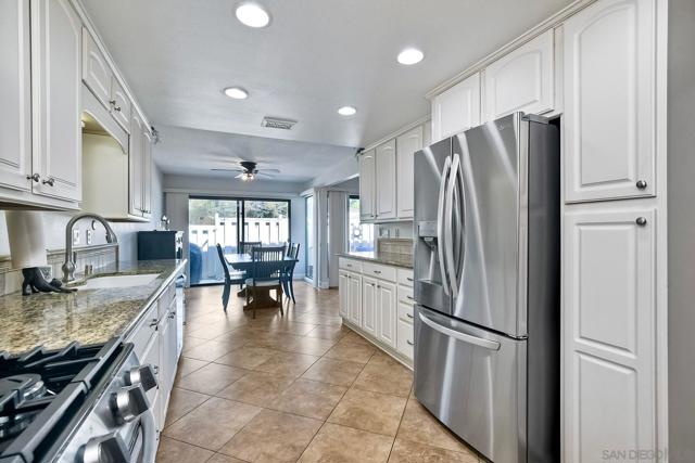 ... updated white cabinetry w/ custom pulls/knobs...