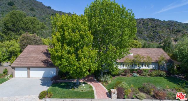 17620 Camino De Yatasto Pacific Palisades, California Located at the top of Camino De Yatasto on a wide flat street in The Palisades Highlands, one of the most undervalued places to live in the entire city. Set in its own microclimate w/perfect weather. This single level traditional backs up to the untouched Santa Monica Mountains & sits on over a half-acre lot in one of the most beautiful settings. This private and gated community has security staff on duty 24/7. A charming 6 bed, 5 bath with impeccable curb appeal includes a 3-car attached garage, grand entry, formal dining & living room w/fireplace. The large family room has pitched ceilings & exposed wood beams throughout. Take in the majestic mountain views from the fenced in 20,000 sf yard; an oasis complete w/pool, spa, outdoor kitchen, fireplace & dining area perfect for alfresco dining. This is the best of both worlds; a mountaintop paradise just minutes away from the beach, Getty Villa & hiking trails. Kick back & enjoy the life you deserve.