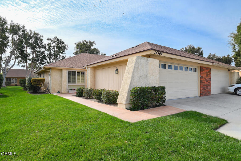 This home is nicely updated 2 car garage Coronado in Leisure Village. The home has great upgrades throughout plus the rare benefit for this neighborhood of having the two car garage. The home has an enclosed patio room across the back of the house that adds about 300 sq ft or very usable space. The are is currently used as an extension of the living room and as an office. The kitchen and bathrooms are all updated. The kitchen has lots of cabinets and there is room for a small table and chairs there too. There are newer windows throughout and the flooring and lighting has also been updated.  This home is very much move-in ready and it sits on a nice little greenbelt between you and the neighbors. Village 16 is on the West end of the community and is easily accessible from the West gate. This upgrades home is priced to sell and has some great features you don't get in all the homes in the community!