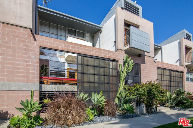 1128 5Th Avenue Venice, California This rare New York Style loft designed by Bill Adams is located one block from Abbot Kinney and 6 blocks from the beach. The unit has high ceilings with skylights and an open design that allow for optimal space and light. The exposed wood beams and polished concrete floors add style and warmth. There is a master suite plus a second bedroom which could be used as an office. The private patio is perfect for relaxation and is great for entertaining. The unit comes with an abundance of parking, with 2 dedicated side/side parking spots and 2 additional guest parking spots for the building.This is Venice living! Welcome Home.