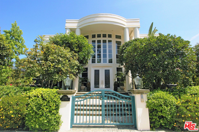 2390 EARLS Court Los Angeles, California Located in Bel Air Crest, a highly sought after gated community tucked majestically above the hills of Los Angeles, sits this modern Mediterranean beauty in a park-like setting. Just beyond the lush landscaping, a dramatic entry opens to great effect as impossibly high ceilings dovetail with a split staircase & regal elegance. Perfect for entertaining, a formal living & dining room, with floor-to-ceiling fenestration open seamlessly to a gorgeous backyard with crisp pool, spa & various patios. The chef's kitchen will delight with its large center island, stone counters, high-end appliances & easy patio/backyard access. 6 beds + 8 baths, including a master suite & all marble bath with Romeo & Juliet balconies, can easily accommodate a family or extended guest. A billiards/media room, separate guest suite with kitchenette, and big underground garage complete this rare offering with easy access to the Westside & Valley. A must-see.