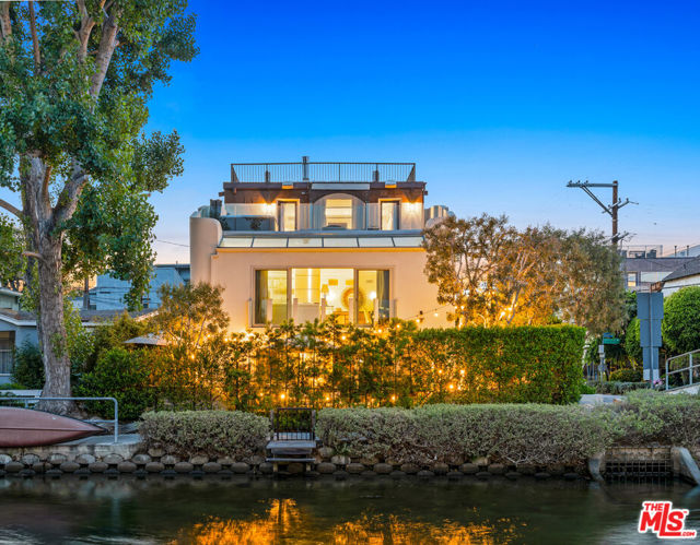 SELLER MOTIVATED. Breathe in the ocean air in this incredibly rare find located in the Venice Canal. This 5 bed / 3.5 bath contemporary home with parking for 6 cars sits on a corner lot with views from every floor and plenty of natural light that shines throughout. Enjoy the weather and entertain in style on the front patio with built-in BBQ, firepit and plenty of seating that flows into the large living room with a fantastic wet bar. The bottom floor also contains 2 guest beds and a bathroom. The main floor features an open concept living and dining room highlighted by high ceilings throughout and floor to ceiling French doors that peer out over the canal. Through the hallway you'll find two more large guest bedrooms and a large guest bath. The entire third floor boasts an expansive master suite that flows out onto a large balcony with breathtaking views that you can soak in as you relax in the hot tub. The master suite is rounded out by a stunning spa-like bath and plenty of closet space. Relax underneath the stars on the massive rooftop deck with 360-degree views. Whether you want to entertain or relax in style, this home offers a once in a life opportunity to enjoy all the best that Venice has to offer.