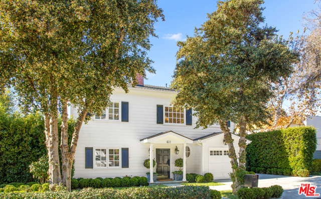 611 Kingman Avenue Santa Monica, California Situated in Santa Monica Canyon, this charming Cape Cod traditional has undergone an extensive, state-of-the-art designer remodel. Showcasing Hermes wallpaper, Fendi crystal chandelier and sconces, and exquisite stone slabs, each room is unique and designed for both aesthetic and functionality. The intimate living room boasts built-in library shelves, a picturesque window bench, and romantic fireplace. The chef's kitchen is fitted with large center island, premium Carrara marble countertops, and Subzero and Miele appliances. Both living and dining rooms open to the outdoors, creating an exceptional indoor-outdoor flow. Upstairs has three en-suite bedrooms, including the master suite with pitched ceilings, balcony, and peek-a-boo ocean view from the StoneForest carved stone tub. Beyond the wooden deck, a grassy yard is hedged-in with mature trees for privacy, while allowing optimal sunlight. The courtyard is ideal for al fresco dining on warm evenings. A true jewel box not to be missed.