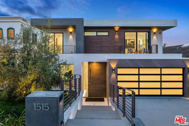 1515 Gates Avenue Manhattan Beach, California Introducing a paragon of modern luxury, 1515 Gates Avenue. This 2020 new construction custom build extends 6,570 sqft of impeccable design and high end finishes. The smart home is equipped with every amenity one could desire including an elevator. The open floor plan allows for seamless flow from the chefs kitchen with a waterfall island and breakfast bar into the great room and onto the dining room. The master bedroom exudes luxury with a private balcony offering views of the serene backyard and a spa like stone filled bathroom. The basement is complete with a bar, large living room, game area, which can be converted to additional bedroom. From several rooms, walls of glass vanish offering flawless indoor/outdoor living. Dramatic outdoor setting perfect for entertaining and relaxation with a vibrant aqua pool, water feature, kitchen, dining area, fire feature and lounge space. 3 car garage with extra parking space on the driveway