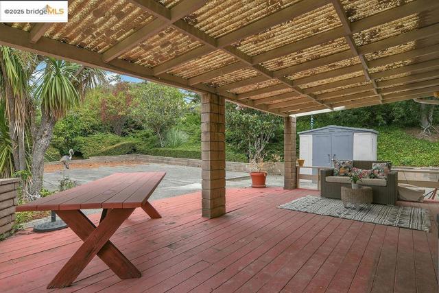 Wooden deck with a storage shed
