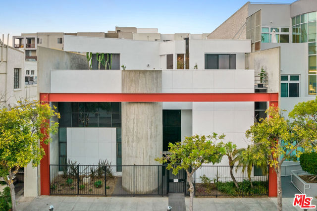 1415 6Th Street Santa Monica, California A world of opportunity awaits with this perfect mixed-use building for investors/occupants located in the heart of Santa Monica minutes from the beach, the farmers market and the 10 freeway. This quintessential California modernist building features completely separate living and workspaces, amazing decks and seamless indoor/outdoor living. The ground floor commercial space is configured with 2 separate entrances, and boasts twenty-foot ceilings, skylights and a mezzanine level. Two private staircases from the ground floor lead up to the loft like single story penthouse which floats like a secluded island in the sky. Floor to ceiling windows and sliding glass doors in every room open onto landscaped terraces offering endless indoor/outdoor living, dining and entertaining possibilities. The loft has three bedrooms and 2.5 bathrooms, all rooms have ceiling heights of over 10 feet. There is a master suite with dual bathrooms, a private library and deck, and two additional bedrooms, one with a complete ensuite bathroom. The powder room is adjacent to the sun filled chefs kitchen, and the penthouse is completed by a spacious NYC loft style living and dining room with a unique custom fireplace. Massive moment frames and cast concrete construction make the building extremely earthquake safe. This construction along with the 20-foot ceiling heights on the ground floor allows for incredible flexibility in expanding and reconfiguring the space for ones needs. The expansive space could be built out into upwards of 14,820sf. The property also offers a secure garage, with five covered and two uncovered parking spaces perfect for personal and business matters alike. Due to the unique nature of the construction, it would be quite easy to expand the number of parking spaces or amount of office space depending on ones needs. It is truly rare that a property with this much space, flexibility and privacy comes available is such a desirable downtown Santa Monica location!
