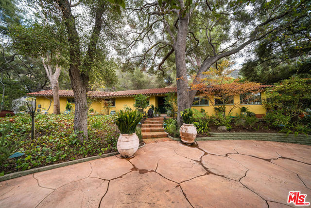 536 Live Oak Circle Drive Calabasas, California Welcome to this serene single story 4 bedroom 3 bath home located in Monte Nido. The gated property is sitauted on an approximately 1 acre parcel surrounded my majestic oaks. The open concept living room offers a warm fireplace and vaulted beamed ceilings as well as windows to the private yard, garden and patio. A sweet family room is open to the kitchen and features french doors to one of the patios. A welcoming lap pool and spa are located directly off the master bedroom. Park at least 5 cars in the circular driveway behind the gates and there is ample street parking in this charming cul-de-sac. Options abound with the yard which feature fruit trees, a small fenced vegetable garden and plenty of room for additional seating destinations. Take advantage of the ocean air influence in this highly sought after area of the Santa Monica mountains. Easy access to the local Backbone Trail, state parks, beaches and more from this location. This special offering is located within the Las Virgenes School district and is in close proximity to Muse school, and Viewpoint Academy.