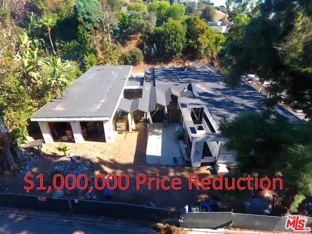 1030 Loma Vista Drive Beverly Hills, California PRICE REDUCED $1MM - Situated on Loma Vista Dr, located in the Trousdale Estates of Beverly Hills, this elevated home is a highly desirable area of Beverly Hills, 90210. The home, currently under-construction, is being marketed to builders, investors, or home owners, who would be interested in completing construction and putting their personal touch on the property with their choice of finishes. The re-designed home is framed, has a foundation, most of the subsurface flooring, electrical and plumbing roughed-in, and roofing mostly complete. The home was originally built in 1959, and many of the original elements remain, including the vintage fire place/chimney chute, the folded-plate roof design in the entrance, living room, and family room. The re-design of the property has provided the home contemporary elements, such interior/exterior interaction, and a subterranean level.