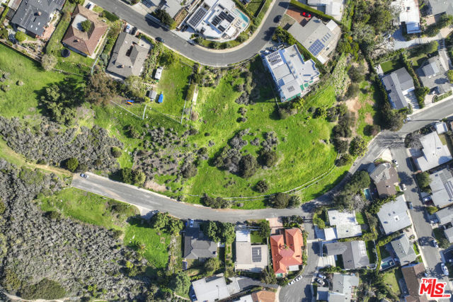 Approximately two acres of prime land consisting of seven adjoining lots with breathtaking ocean and city views being sold together in the prestigious area of Marquez Knolls in Pacific Palisades. Just 0.9 mi from Marquez Charter Elementary School, 2.2 miles from Palisades High School and 2.2 miles from Palisades Village. No entitlements in effect or being processed for the development of the subject properties. Prospective buyers to undertake their own independent due diligence investigations concerning, without limitation, ability to obtain any entitlements and any future development of the subject properties. White line in photos is only an approximation of property lines. Prospective buyers to independently verify square footage of the lots and rely solely on their own investigation. Lot APN's: 1. 4419-005-041, 2. 4419-005-042, 3. 4419-005-071, 4. 4419-005-072, 5. 4419-005-073, 6. 4419-018-039, 7. 4419-018-040. All to be sold together.