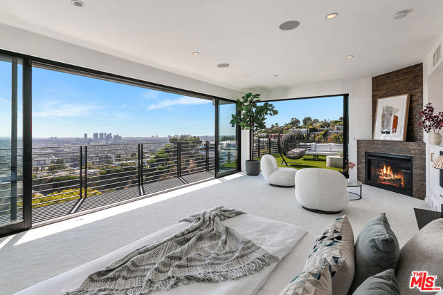 1501 VIEWSITE Terrace Los Angeles, California Newly remodeled entertainers paradise with explosive 360 degree views. Gated for privacy & security with 2-car garage direct access, magical walkway to front door and yard and third side access designed for service with direct access to kitchen. Lushly landscaped flat yard, pebble bottom salt water pool/spa, sunken fire pit, outdoor kitchen & gazebo. Chef's kitchen with Viking, Miele and Sub-Zero Stainless Steel Appliances. Scintillating views from Downtown and Century City to the Ocean on all levels. Fleetwood sliding glass doors and wrap-around decks with over 1,450 sq ft. of additional outdoor living space. 3 plush en-suite beds with his and her baths, floating tub, steam shower, jetted tub, bidet and impressive primary walk-in closet. 850 sq ft. rooftop-like deck off primary bed with breathtaking city and hillside views of famed Bird Streets. Screening room with cove lighting, projector, Blu Ray & Sonos. Possibility to convert screening room to 4th bedroom and re-locate screening room to second-floor family room. Elevator with access to every floor. See showing remarks for instructions and "docs" section of MLS for floor plan and verification of listed square footage.