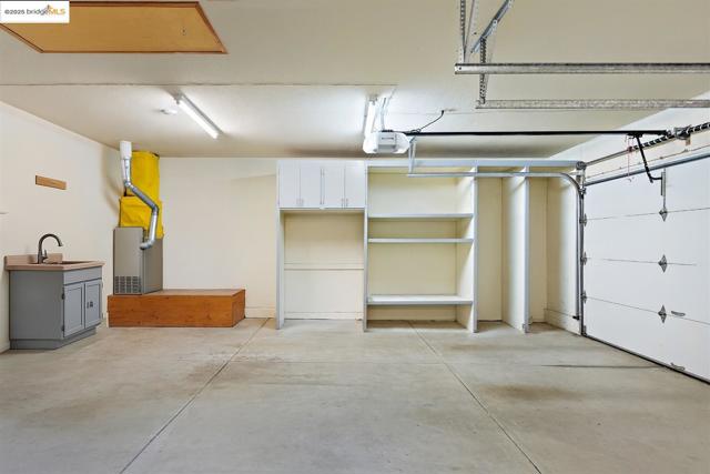 Garage with a garage door opener and heating unit