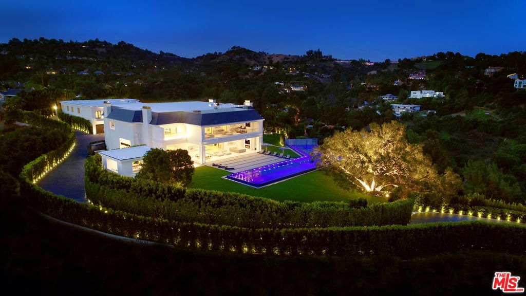 One of the most private and secured estates in Beverly Hills 90210 with stunning mountain views. The newly rebuilt & expanded Wallingford estateis spread over a 5-acre exclusive promontory. A one-of-a-kind indoor sports complex w/ basketball, pickleball, gym, boxing ring, sports lounge & bar allcelebrate an active lifestyle & the love of sports. Located just 8 minutes from the BH Hotel & 20 minutes from Van Nuys private airport, both entrances can onlybe accessed through private/gated streets. Exquisitely designed & built w/ impeccable taste, the sophisticated & stylish estate infuses today's technology w/magnificently refined rooms. Totaling approx. 46K SF under roof & approx. 38K SF under A/C & boosting 12 bedrooms & 24 bath, approx. 5K SF guestpenthouse, caretaker house, 2-bdrm guardhouse, 10 car garage & parking for 80. The biggest zero edge pool in BH perfectly frames the extensive grounds &views. Additional property on private street also available separately.