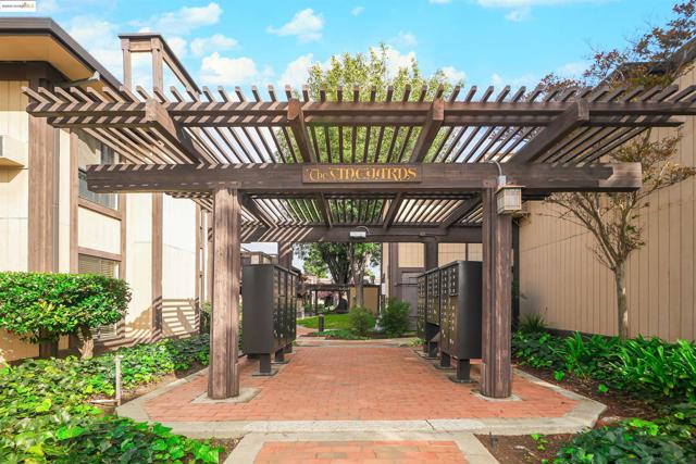 View of patio featuring mail area and a pergola