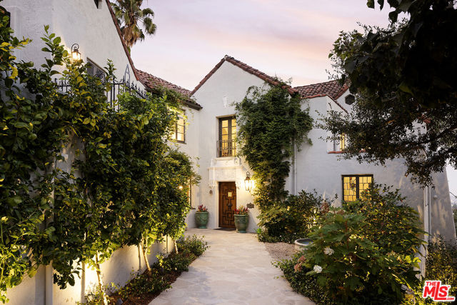 4808 Bonvue Avenue Los Angeles, California Resplendent period 1924 Spanish Colonial on one of Los Feliz' most coveted streets. Commissioned by entrepreneur William C. Hay and completed by architect Charles H. Kyson this Architectural Digest published home truly embodies Hollywood's golden-era. Sited hillside, the multi-tiered property takes full advantage of panoramic city views while providing complete privacy at street level. Meticulously renovated and maintained Bonvue features a double-height grand living room, with coffered, hand painted ceilings, towering French doors, step-down den and wet-bar, all accessed from the scene-stealing foyer staircase. The imported English wood-panelled formal dining room includes a second level verandah, an ornamental plaster ceiling and stained glass vignettes, a bespoke detail that runs throughout the home and compliments the many hand painted oak doors. The primary bedroom offers an oversized en-suite and elevated closet. A chef's kitchen, 600 bottle wine cellar, elevator, family room, library, staff-rooms and home offices all round out this unique interior offering. The extensive grounds feature multi-level terraces, gravel pathways, hidden gathering spaces and repurposed speak-easy, outdoor dining, and an abundance of fruit trees. A formal lawn with period fountain leads to a private pool, visible only from the home. Truly an enviable, charming, one-of-kind piece of Hollywood history, moments from The Griffith Observatory, Greek Theatre and the other grand estates of Los Feliz. **Newly measured at 6,827 SqFt. Floor plan available in documents**