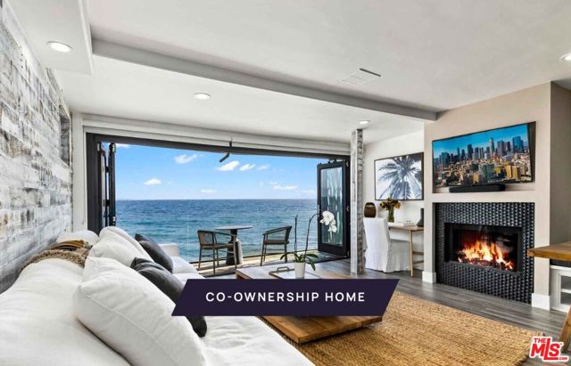 New co-ownership opportunity: Own one-eighth of this professionally managed, turnkey home. The Pacific is front and center in this contemporary oceanfront home that maximizes the views and beach lifestyle. The living space features a dining area with banquette seating, a brick fireplace and bi-fold French doors that open to a cozy covered deck. The kitchen has stainless steel appliances, a double-drawer dishwasher and access to the 2-car garage.  Skylights bring warm shafts of light throughout the second floor. The zen-like primary bedroom features bi-fold doors to a private balcony overlooking the ocean, a modern fireplace and an en suite bathroom with soaking tub, dual-sink vanity and a marble tiled shower. Another bedroom and a bunk room ensure there's plenty of room for guests.  Below the main floor, the nearly 1,000-square-foot foot deck has been transformed into an entertainment haven, featuring a tiki bar, dining table, chair swings and a motorized, waterproof door. The home comes fully furnished and professionally decorated.