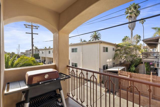 An intimate outdoor nook for grilling just a stroll from the sand.