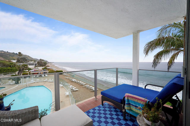 PRICE IMPROVED $650,000! Enjoy true resort-style living at the Malibu Outrigger, a classic, Mid-Century Modern condo building with unparalleled ocean views and direct access to Carbon Beach, (aka ''Billionaire's Beach''). Wake to the breathtaking sunrise and enjoy enchanting moonlit evenings on Santa Monica Bay with ''Queen's Necklace'' coastline views from Santa Monica to Catalina. This 2 bedroom/2 bathroom features a spacious 1,200 square foot layout with formal entry, large living/dining area with fireplace and unbeatable amenities. Large glass sliders open to a covered corner balcony with fantastic ocean views overlooking the large pool and spa. Kitchen features stainless steel appliances, Viking range, quartz counter tops and plenty of light wood cabinetry. The primary bedroom boasts an en suite bath with twin vanities, quartz counters, tub/shower, walk-in closet and large secondary closet providing plenty of storage. The second full bathroom has quartz counters, crisp white cabinetry and glass enclosed shower. Custom touches include bamboo hardwood flooring, California Closets, recessed lighting and new bedroom ceiling fans. The second bedroom includes another large closet and makes a great guest room/home office combo. 2 dedicated garage parking spaces are included and include a large locking storage cabinet. The Malibu Outrigger is a secure elevator building with an onsite management and maintenance team, a newly redecorated lobby, Wi-Fi throughout the property, state of the art, app-based building access system, a convenient laundry room with smart-phone controlled machines and a nicely equipped gym. Monthly HOA fee includes common area maintenance and utilities as well (water, electric, gas, septic, trash, gym). Everything you need is within a short distance. Choose from world-class dining options, shops and services with Nobu, Soho House, Malibu Farm, Dreamland, V's, Nicholas Eatery, Caffe Luxxe and Malibu Farm just down the street. World-Famous Malibu Pier and Surfrider Beach are also nearby, as is Whole Foods and Cross Creek shopping center with local favorites like Lucky's, Taverna Tony, Tra di Noi, Howdy's, Cafe Habana and Broad Street Oyster. You'll feel like you're a thousand miles away in this exclusive enclave, but just minutes to from the best of L.A.