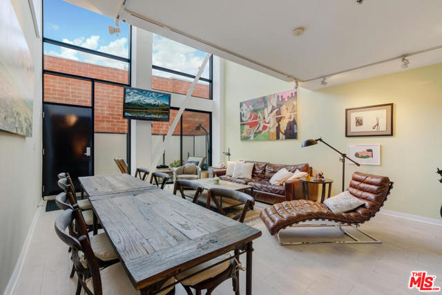 700 Main Street 7 Venice, California A LIVE/WORK architectural townhome in the acclaimed Venice Dogtown Lofts! The opportunities here are abundant including possible tax benefit for certain business uses - verify with your accountant. This home differs from most other neighboring lofts as there is a flex space on the first floor with bathroom, wet bar, and separate entrance, currently used as a third bedroom. Additionally, this could be sold with an adjacent similar unit. The double height, open concept living/dining/kitchen, with powder/laundry room, has its own entrance through a private @200 SF terrace. Upstairs are two large bedrooms, one with a walk-in closet, and two baths share a water closet. All just a short distance to the Pacific Ocean, Main Street Dog Park, Abbot Kinney Blvd, Main Street, and Rose Avenue restaurants and shops. Two side by side covered parking spaces and communal visitor parking, security cameras, intercom entry, elevator, earthquake insurance are included with HOA.