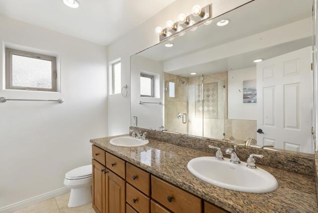 Stone and glass unite in a tranquil suite bathed in soft, natural light.