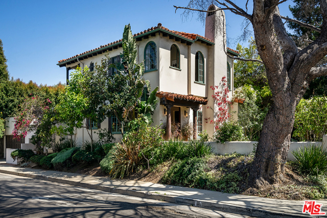 350 Beirut Avenue Pacific Palisades, California Magical, once-in-a-decade Palisades corner lot oasis half a block from the Via de las Olas bluff and the vast, blue Pacific below. Serene, Montecito-style Mediterranean with former restoration/expansion by featured Architectural Digest architect Winston Brock Chappell. Primary suite aerie with hewn-beamed ceiling, wood-burning fireplace, and sun dappled, private balcony for peaceful meditation or curling up with a book. Living room opens to charming outdoor private courtyard and patio for dining al fresco. Hardwood floors, curated Spanish tile stairway details, lighting fixtures and additional fireplace details by celebrity and international resort designer Steven Handelmann. Private lap pool. Rare, grandfathered walled and gated front yard. Complete convenience to fine dining and shopping at Caruso's Palisades Village. A cherished, impossible-to-duplicate location on the corner of Beirut and Friends Street. Move-in or remodel/upgrade into your pitch-perfect jewel box by the sea.
