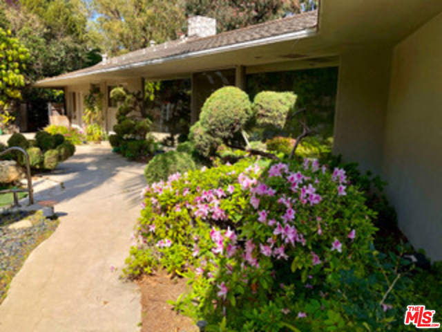 435 Layton Way Los Angeles, California A truly rare offering- this jewel of a property sits on over an acre of incredibly private park-like grounds. This one of a kind single level mid-century home has been lovingly maintained. Enjoy the many charming details including a circular dining room with a rotating floor and walls of glass overlooking serene views and Japanese garden. Bring your designer and reimagine this gem or live here while planning to build a private estate overlooking serene views above the treetops. Located in the coveted, guard-gated Brentwood Circle community in prime Brentwood.